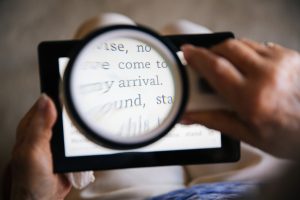 teenage boy reading from a tablet